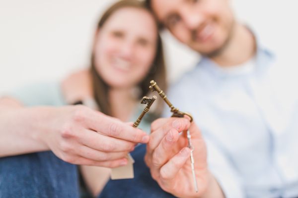 Couple holding house keys